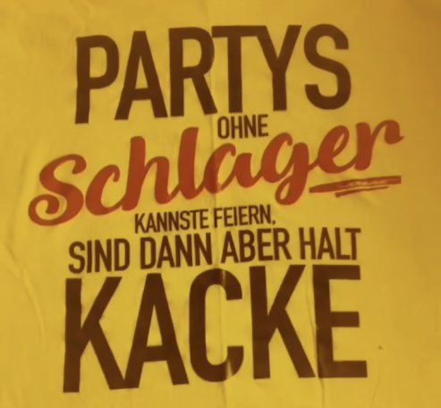 Gelbes T-Shirt mit dem Text: "Partys ohne Schlager kannst du feiern, sind dann aber halt Kacke."
